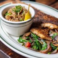 Blackened Redfish · Fresh Louisiana red drum, blackened with cajun spices, served with two sides of your choice.