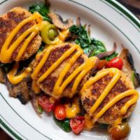 Crab Cake Maspero · Three house special crab cakes served on a bed of sautéed spinach, heirloom tomato, mushroom...