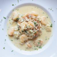 Seafood Pot Pie · Gulf shrimp, blue crab, fresh herbs in a rich cream sauce with parmesan cheese served over a...