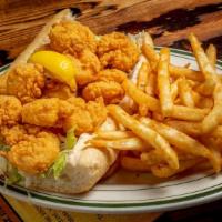 Fried Gulf Shrimp Po-Boy · Gulf shrimp fried to a golden brown dressed with lettuce, tomato, pickle and tabasco mayo.