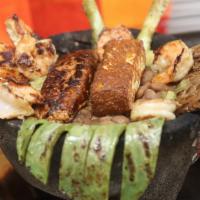 Molcajete · A Complete Parrillada 4oz Grilled Rib-Eye / Grilled Chicken Breast / Chorizo (Mexican Sausag...