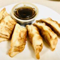 Pork Dumplings (6 Pcs) · Dumpling with pork and veggies served with a side of ginger dipping sauce.
Please specify fr...