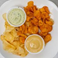 Kettle Chips & Dips · Kettle chips served with choice of two dips: basil garlic aioli, penny's, jalapeño pimento c...