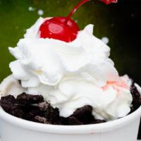 Dalmatian Sundae · Creamy gelato topped with crumbled Oreo cookie pieces and whipped cream, topped with a cherry.