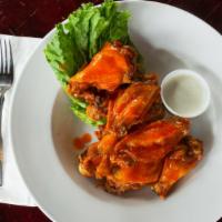 Chicken Wings · Tossed in your choice of sauce ~ buffalo, bbq, cajun, old bay, garlic parmesan, teriyaki, sw...
