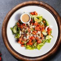 Greek Salad · Crumbled Feta, black olives, sliced cucumber, tomatoes, red onions, Green peppers tossed ove...