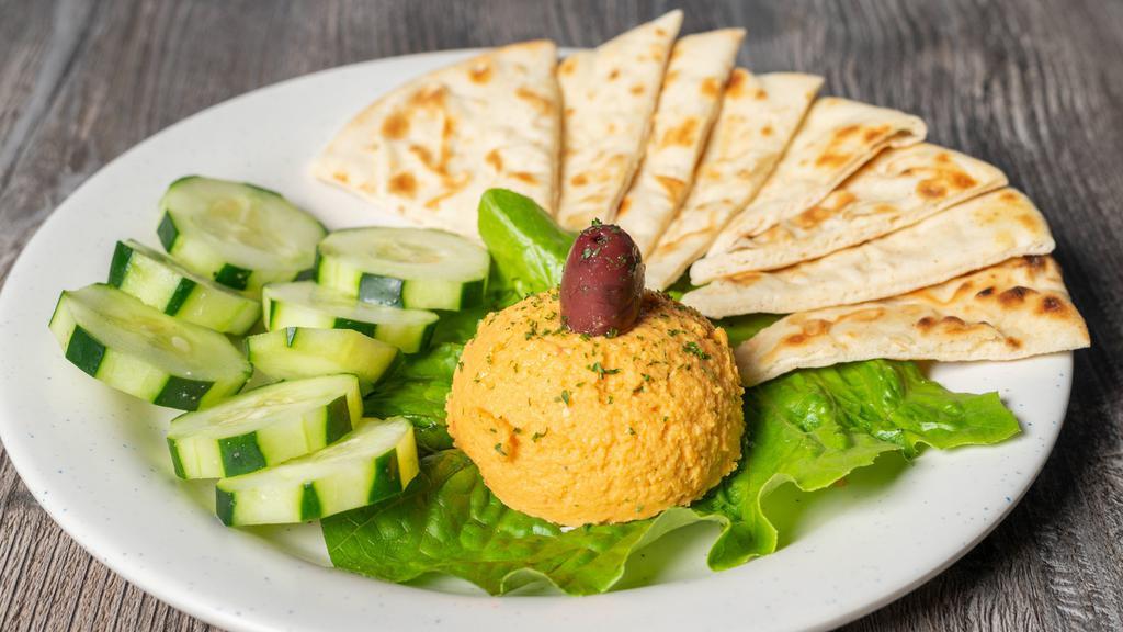 Flavored Hummus · Assorted flavors made fresh in house served with pita bread.