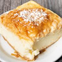 Galaktompoureko · Phyllo dough brushed with butter and filled with a semolina, whole milk, fresh egg custard f...