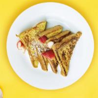 Classic French Toast · Fresh bread battered in egg, milk, and cinnamon cooked until spongy and golden brown.