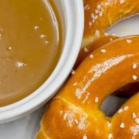 Soft Buttery Pretzels · Two soft, salt-sprinkled pretzels with your choice of our housemade beer cheese sauce, with...