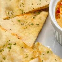 Hummus & Warm Flatbread · GF Available - Housemade hummus served with fresh-from-the-oven warm, seasoned and cut pita ...