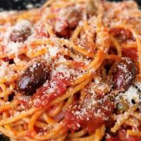 109 Spaghetti Alla Puttanesca · Tomato sauce with onions, crushed red pepper, oregano, black olives, capers, anchovies, Extr...