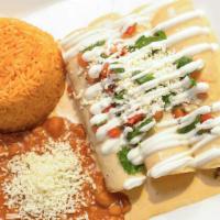 Enchiladas Chipotle · Three enchiladas, one shredded beef, one ground beef and one chicken. Topped with a creamy c...