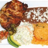 Pollo A La Plancha Con Arroz And Frijoles Y Ensalada · Grilled chicken, served with rice, beans, and salad.