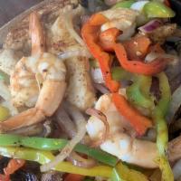 Fajitas Mixtas · Mixed Fajitas, steak, chicken, and shrimp fajitas served with rice, beans, pico de gallo, an...