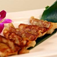 Gyoza (6) · Japanese style dumpling stuffed with chicken and pork. Served steamed or pan fried.