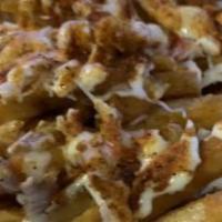 Crab Meat Fries · Cajun Fries Topped with real Crab Meat and Cheese Sauce