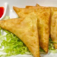 Crab Rangoon (6) · Crab and cream cheese filled wontons fried until golden brown.