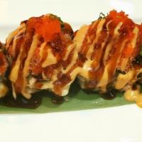 Volcano Roll · Spicy. Deep fried roll california roll topped with baked spicy crab meat, crunch.
