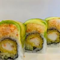 Queen Roll · Spicy white tuna and cucumber inside topped with avocado and caviar.
