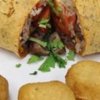 Lomo Wrap · marinated beef/white rice/tomato/onion/choise of spinach or sundried tomato