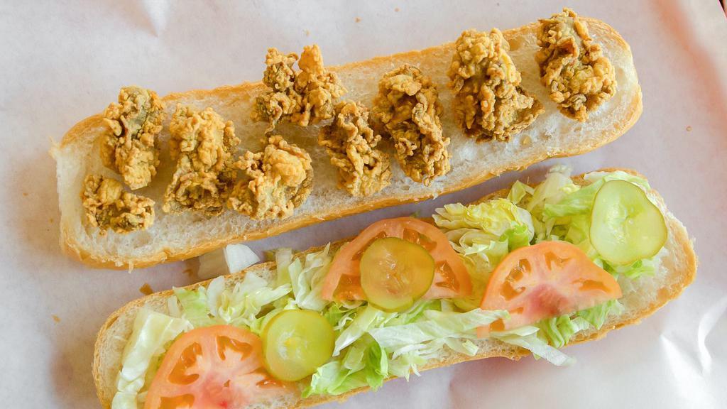 Oyster Sandwich · Dressed with mayo, lettuce, tomato and pickles.