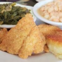 Catfish Nuggets · A generous portion of deep-fried cat nuggets is served with two sides and bread.