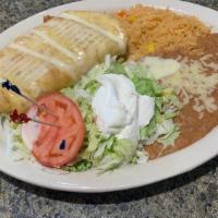 Fajita Chimichanga · With choice of meat.  Fried flour tortillas stuffed with bell peppers, onions and cheese.  T...