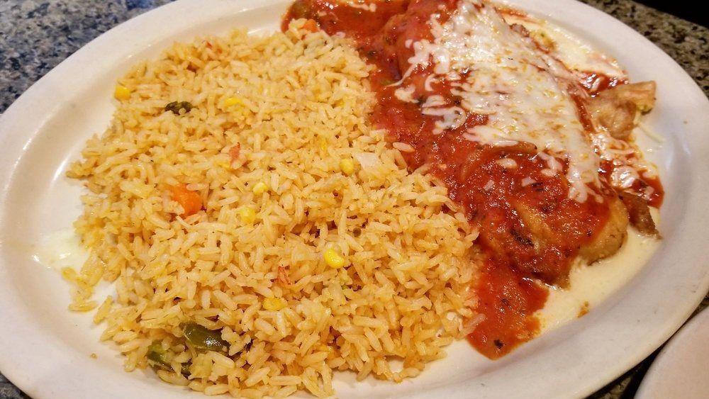 Huevos Con Chorizo · Two scrambled eggs cooked with Mexican sausage.  Served with rice, beans and three flour tortillas.