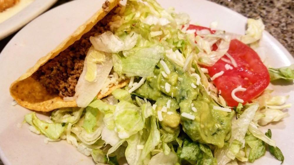Taco Salad  · With choice of meat.  A lunch-sized fried tortilla filled with cheese and sour cream.