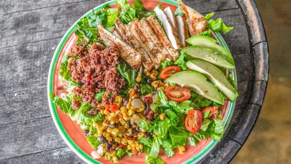 Cobb Salad · Chicken, bacon, boiled eggs, corn, black beans, tomato, green onion, and cheddar on mixed greens.