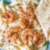 Fettuccine · Chicken or shrimp with alfredo sauce and a side of bread.
