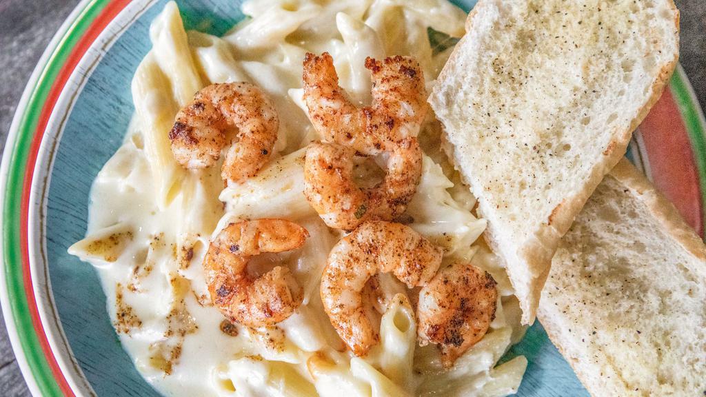Fettuccine · Chicken or shrimp with alfredo sauce and a side of bread.