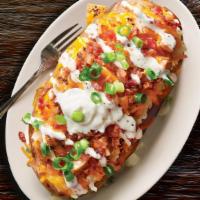 New! Cb Ranch Potato · Grilled, 100% antibiotic-free chicken breast, cheddar, sour cream, butter, bacon, green onio...