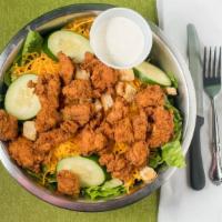 Fried Chicken Nugget Salad · Fried free-range chicken nuggets on a bed of Romaine lettuce with shredded cheddar cheese, c...