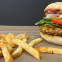 Dare Ya · Grass-fed beef patty topped with crisp bacon, yellow Cheddar cheese, spring mix lettuce, tom...