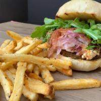 Voodoo Moo-Moo · Grass-fed beef patty topped with  bleu cheese crumbles, arugula, sautéed onions, and srirach...