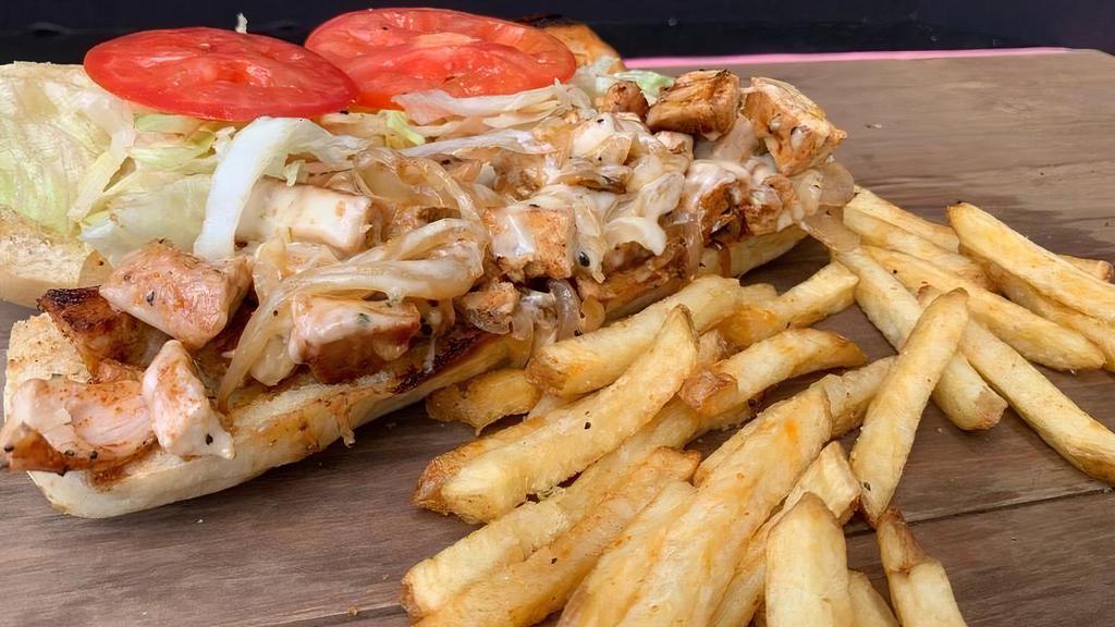 Chicken Philly · Free-range chicken breast chopped and topped with grilled onions, pepper jack cheese, shredded lettuce, tomato, and our signature Acre sauce. Served on a hoagie.