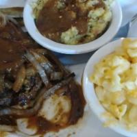Hamburger Steak (12 Oz.) · With grilled onions and gravy and 2 sides.