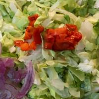 House Salad · Lettuce Mix, Pimento, Romaine and Iceberg, shaved red onion, and Provel cheese with our hous...