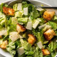 Caesar Salad · Lettuce Mix, Romaine, shaved parmesan, and croutons with Caesar dressing.