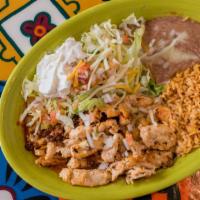 Tacos De Carnitas · Three corn tortillas filled with pork and cooked to perfection. Served with rice, beans, let...