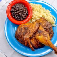 Roasted Chicken · A slowly roasted chicken, marinated in a citrus-based mojo, served with black beans and rice.