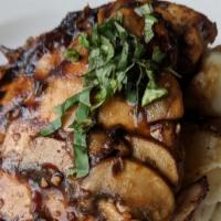 Portobello Chicken And Mashed Potatoes · Two marinated grilled chicken breasts over red mashed potatoes, smothered with sautéed baby ...