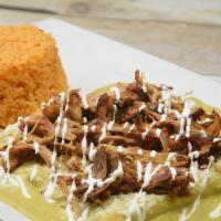 Enchiladas Tlaquepaque · 3 corn tortillas, stuffed with queso fresco, topped with shredded pork carnitas, and covered...
