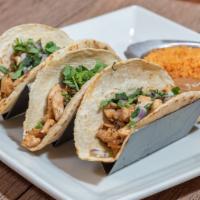 Tacos Grilled Chicken · 3 tacos served with rice, beans, cilantro, and onions.