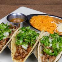 Tacos De Carnitas · 3 tacos served with rice, beans, cilantro, and onions.