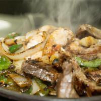 Fajitas · Your choice of tender slices of chicken, beef, or a combination of both. Cooked with onions,...