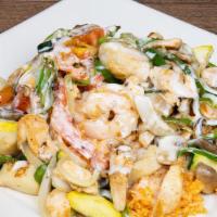 Tierra Y Mar · Grilled shrimp, scallops and chicken, bell peppers, onions, tomatoes, squash, zucchini, and ...