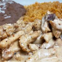 Chicken Chipotle · Sliced grilled chicken in a mild chipotle cheese sauce. Served with rice, beans with cheese,...